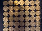 a lot of gold coins in a black box
