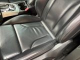 a black leather seat in the back of a car