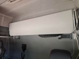 an image of the inside of a van with the door open