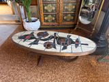 a coffee table with a mosaic design on it