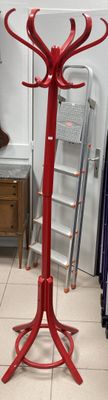 a picture of a red coat stand in a room