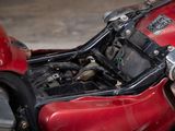 a close up of a red motorcycle with its engine in the back