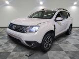 the white dacia is parked on a checkered tile floor