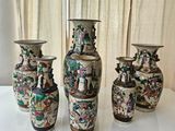 three vases are sitting on a table in front of a curtain