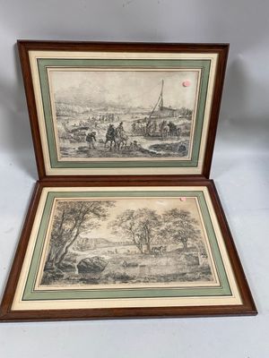 two framed prints of a landscape with a man on a horse and a man on a horse