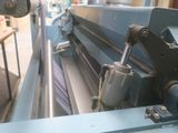 an image of a machine that is working on a piece of paper