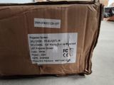 a cardboard box with a sticker on it sitting on the floor