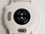 a close up of a watch on a white surface