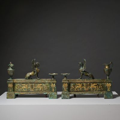 two bronze statues of a horse and a man on a bench