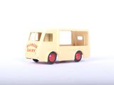 a toy bus that is sitting on a white surface