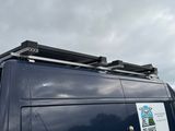 a van that has a sign on the side of it