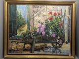 un tableau représentant une brouette remplie de fleurs