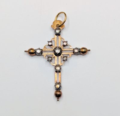 an image of a cross made of gold and diamonds on a white background