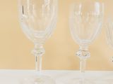 three empty wine glasses sitting on a table
