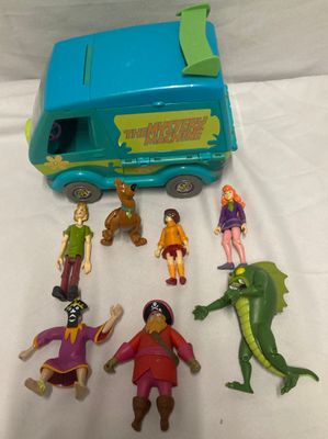 the scoozies are playing with their toys on the bed
