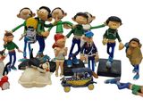many figurines of people that are posed together