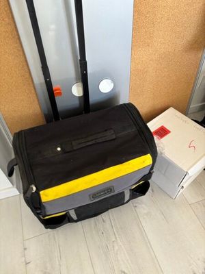 a piece of luggage sitting on the floor next to a wall