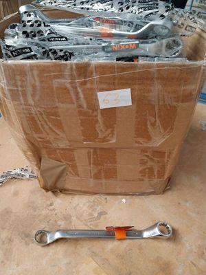a lot of wrenches in a box on the floor