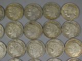 a lot of coins that are sitting on a table