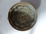 a close up view of a vase with a flower in it