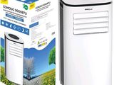un climatiseur blanc posé à côté d'un carton