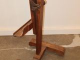 a wooden stand with a pair of skis on top of it