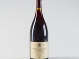 a bottle of wine that is sitting on a table