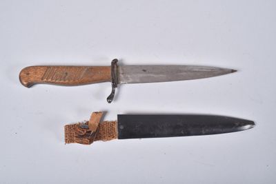 two knives that are laying next to each other on a table