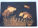 two goldfishs swimming in a pond of water