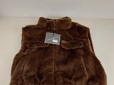the brown fur vest has a tag on it