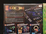 a black hole board game on the table