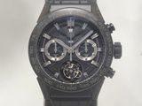 a close up of a watch with a black face