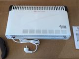 une boîte surmontée d'un radiateur blanc