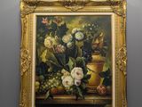 painting of a still life of flowers and fruit in a gold frame