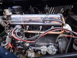 a close up of a car ' s engine in the back of a truck