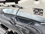 a close up of a car engine with its hood open