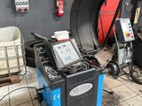 a machine that is sitting on the floor in the garage