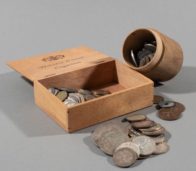 a small wooden box with coins in it