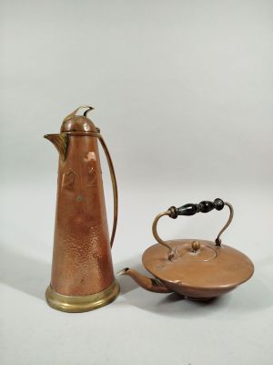 a small copper teapot and a small copper teapot on a white background