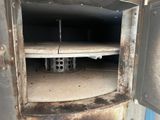 a dirty oven with a hole in the middle of it