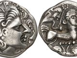 a close up of a coin with a horse on it