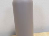 a bottle that is sitting on a wooden table