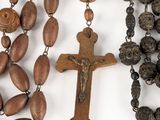 rosary beads and a crucif on a white background