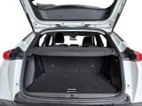 the back of a car with the trunk open and the seats folded down