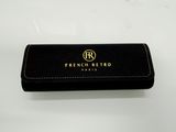 a black purse with a gold logo on it