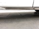 a white truck that is parked in a parking lot