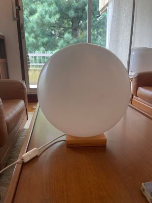 a lamp that is sitting on a table in a living room
