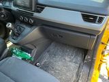 a car dashboard with a steering wheel and dashboard controls