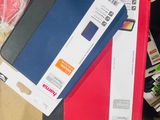 a person holding a red and blue case and a black and white box
