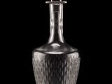 crystal decanter on a black background with a black background